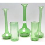 A collection of believed 19th century green Nailsea glass to include three solifleur single stem