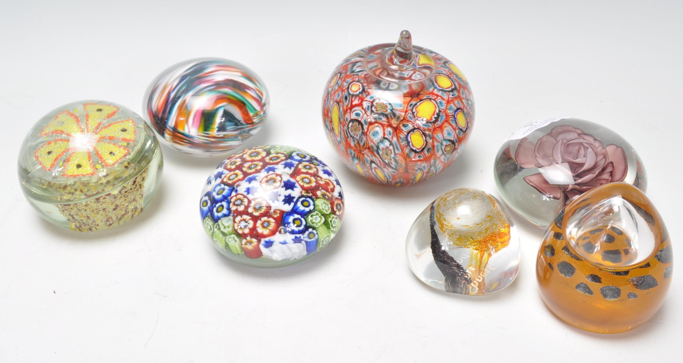 A mixed group of vintage 20th Century glass paperweights to include millefiore examples, Caithness