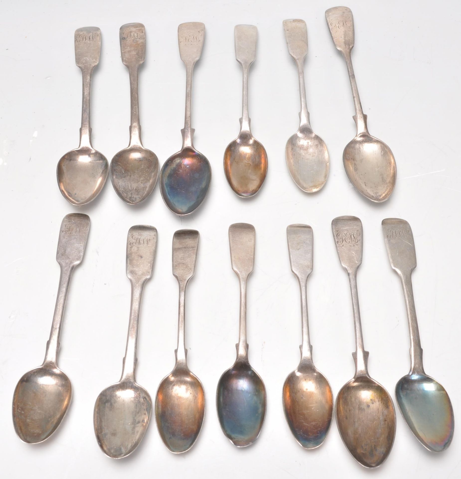 A mixed group of thirteen 19th Century Georgian and Victorian hallmarked silver spoons of similar