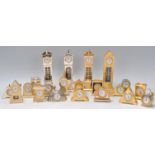 A collection of brass and yellow metal miniature novelty quartz clocks (mostly by Estyma) many in