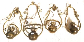 A collection of  4 contemporary   antique style large brass hanging lantern of oil lamp type with