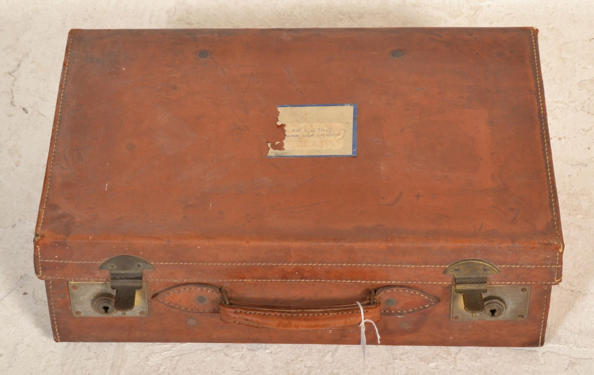 A good quality early 20th century leather suitcase with clasp locks and leather handles, remains - Image 3 of 4