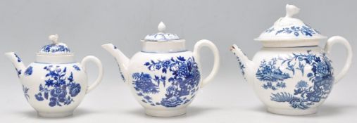 A group of three Old Worcester blue and white Chinoiserie tea pots being transfer printed with