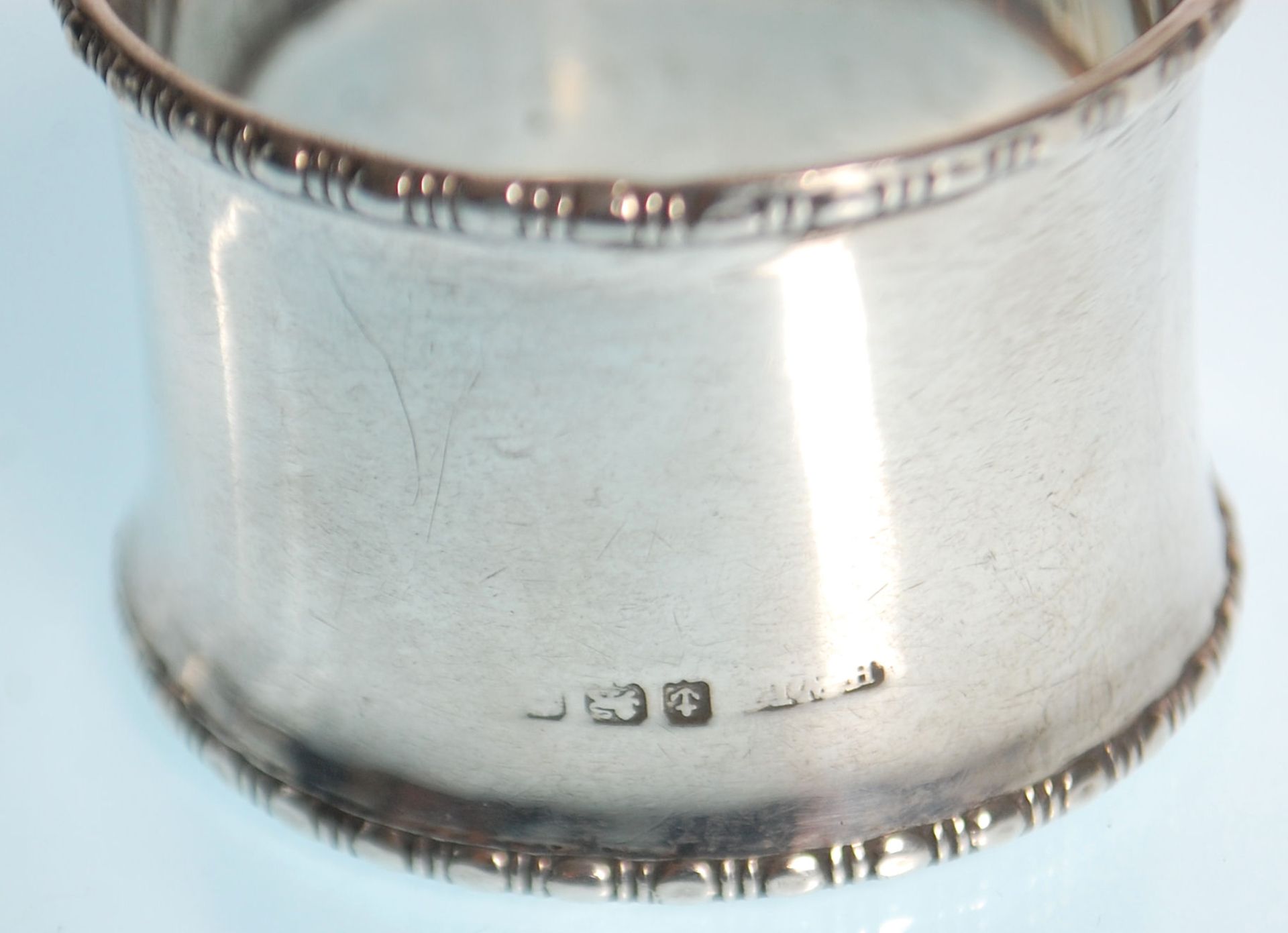 Two silver hallmarked napkin rings to include one with gadrooned borders and engraved initials to - Image 6 of 6
