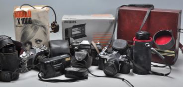 A mixed group of vintage 20th Century photographic and film cameras to include a cased Bell & Howell