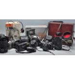 A mixed group of vintage 20th Century photographic and film cameras to include a cased Bell & Howell