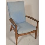 A vintage mid century Parker Knoll  armchair. The chair with square tapering legs and shaped elbow