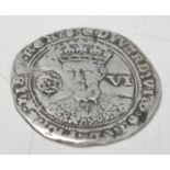 A silver hammered sixpence of Edward VI (1547-1553) dating to c. 1551-1553.  Obverse: EDWARD. [VI