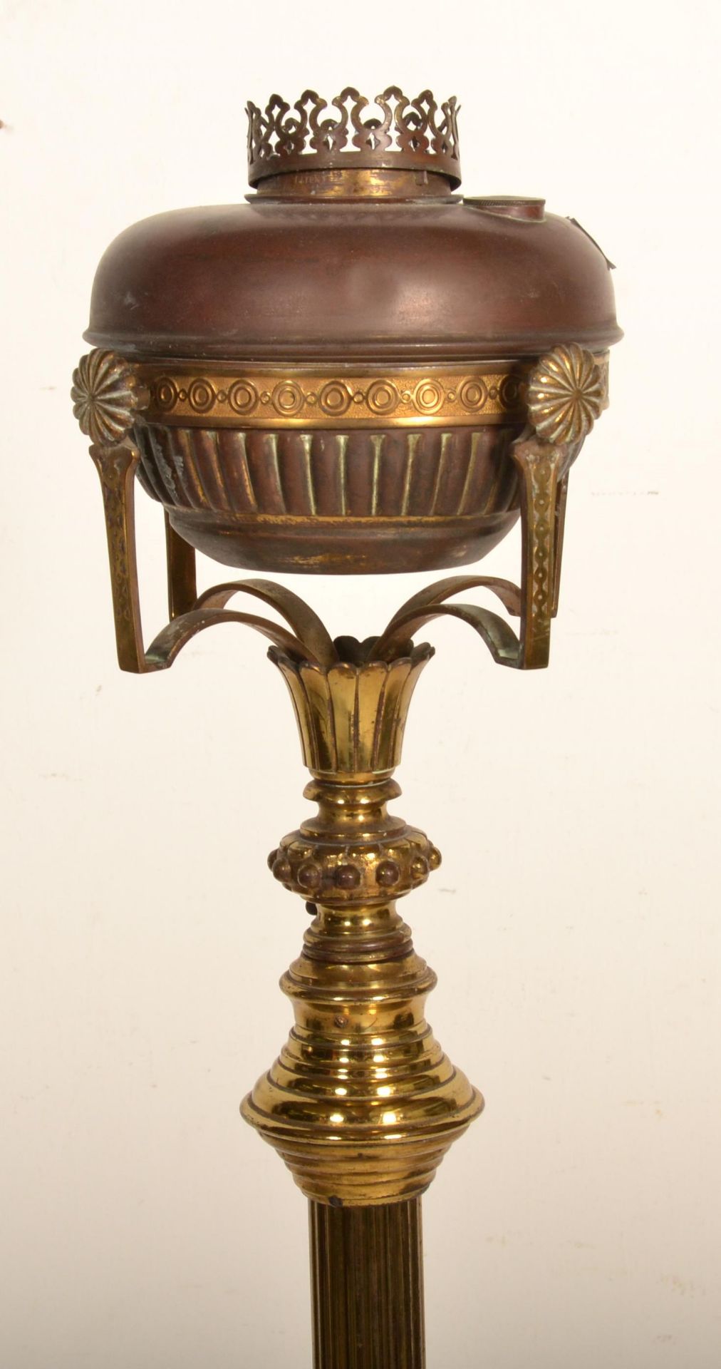 A 19th Century Victorian free standing oil lamp raised on a round base with three shell formed feet, - Image 3 of 4