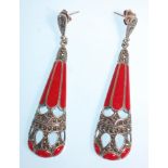 A pair of stamped 925 silver ladies earrings having drops set with marcasites and red enamelled