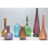 A mixed selection of vintage retro studio art glass vases of various colours and designs. Some twist