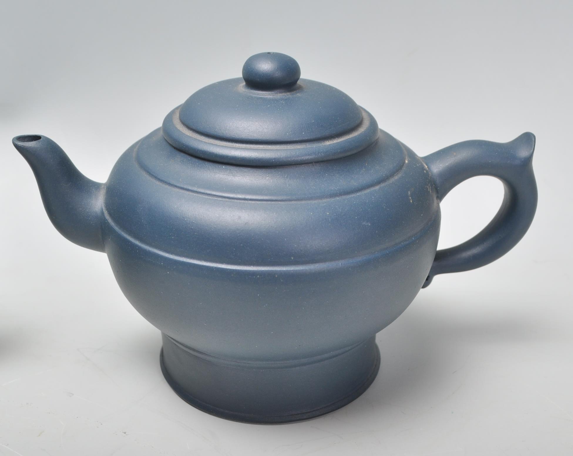 A Chinese Yixing clay teapot having carved decoration of a seated male figure with character marks - Image 6 of 13
