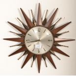 Metamec - A 20th century retro vintage sunburst starburst wall clock having a silvered face with