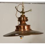 A large industrial factory style pendant lamp of modern construction in brushed gold aluminium