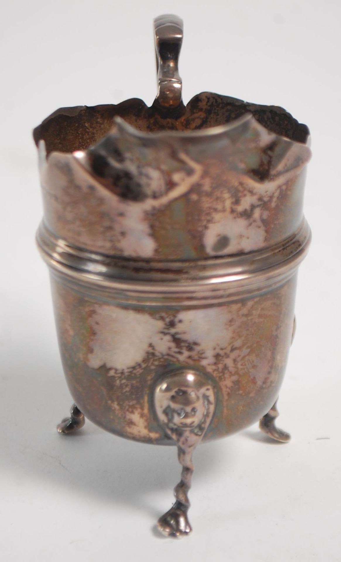 An early 20th Century silver hallmarked creamer jug having a flared top with banded center raised on - Image 5 of 9