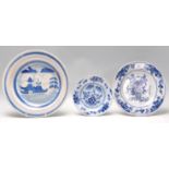 A group of three blue and white delft plates to include an 18th Century plate decorated with a