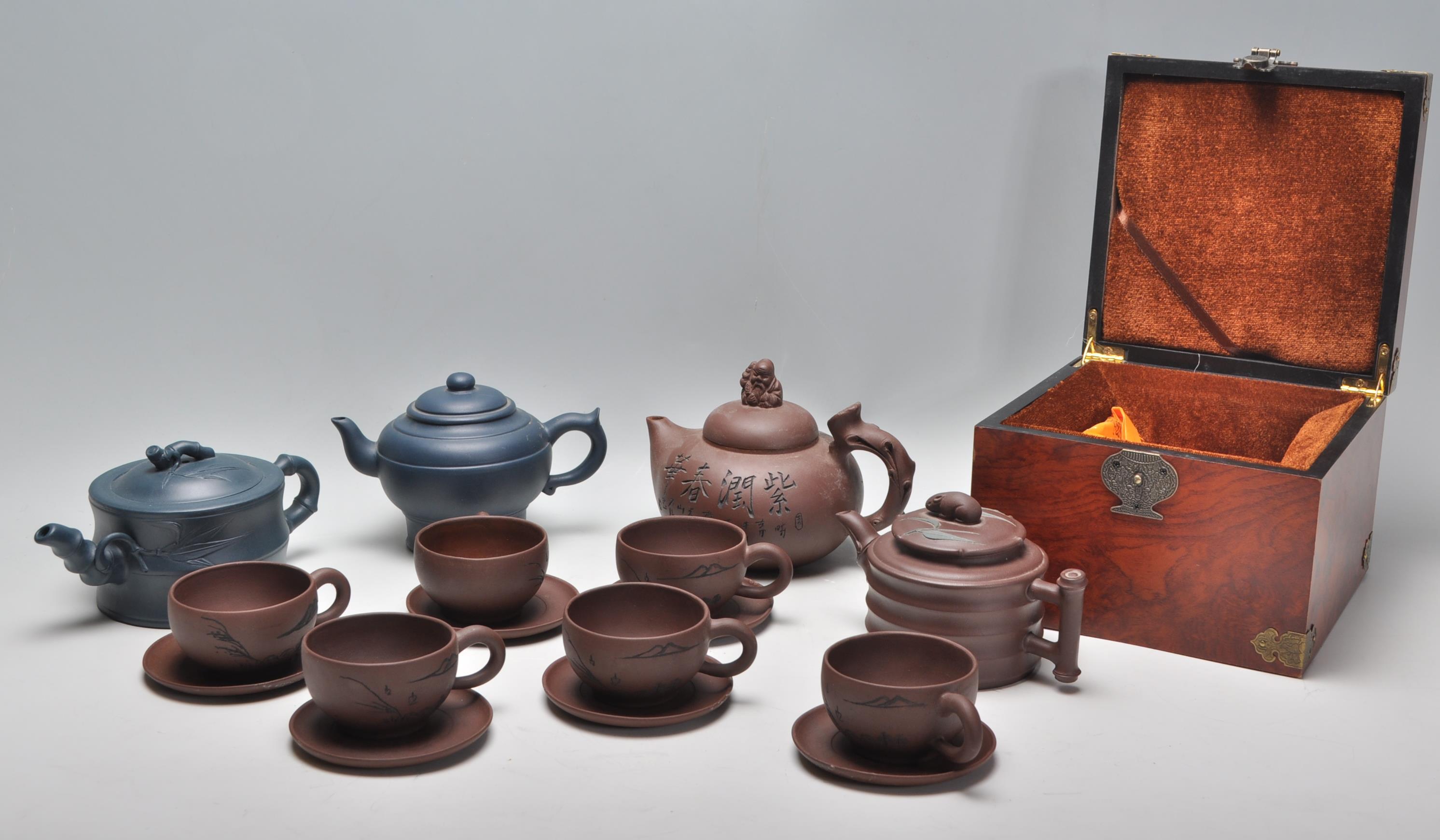 A Chinese Yixing clay teapot having carved decoration of a seated male figure with character marks - Image 10 of 13