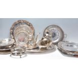 A mixed group of silverplate wares dating from the early 20th Century to include mostly trays with