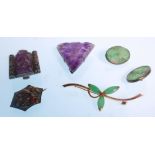 A collection of jade and amethyst jewellery to include two Chinese carved amethyst lapel brooches