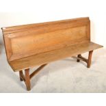 A 19th century Victorian rustic pine church bench pew / hall settle. Raised on shaped supports