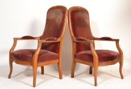 A pair of 1900's French walnut empire revival armc