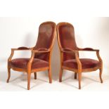 A pair of 1900's French walnut empire revival armc