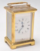 A 20th Century French Bayard 8 day carriage clock being brass cased with three sides set with glazed
