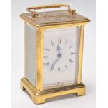 A 20th Century French Bayard 8 day carriage clock being brass cased with three sides set with glazed