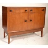 A vintage retro mid 20th Century teak wood sideboard credenza raised on angular tapering supports