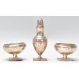 A pair of sterling silver table salts of bulbous form having open top with gadrooned borders