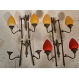 A collection of 20th century antique style lamps having bright and colourful teardrop shades. The