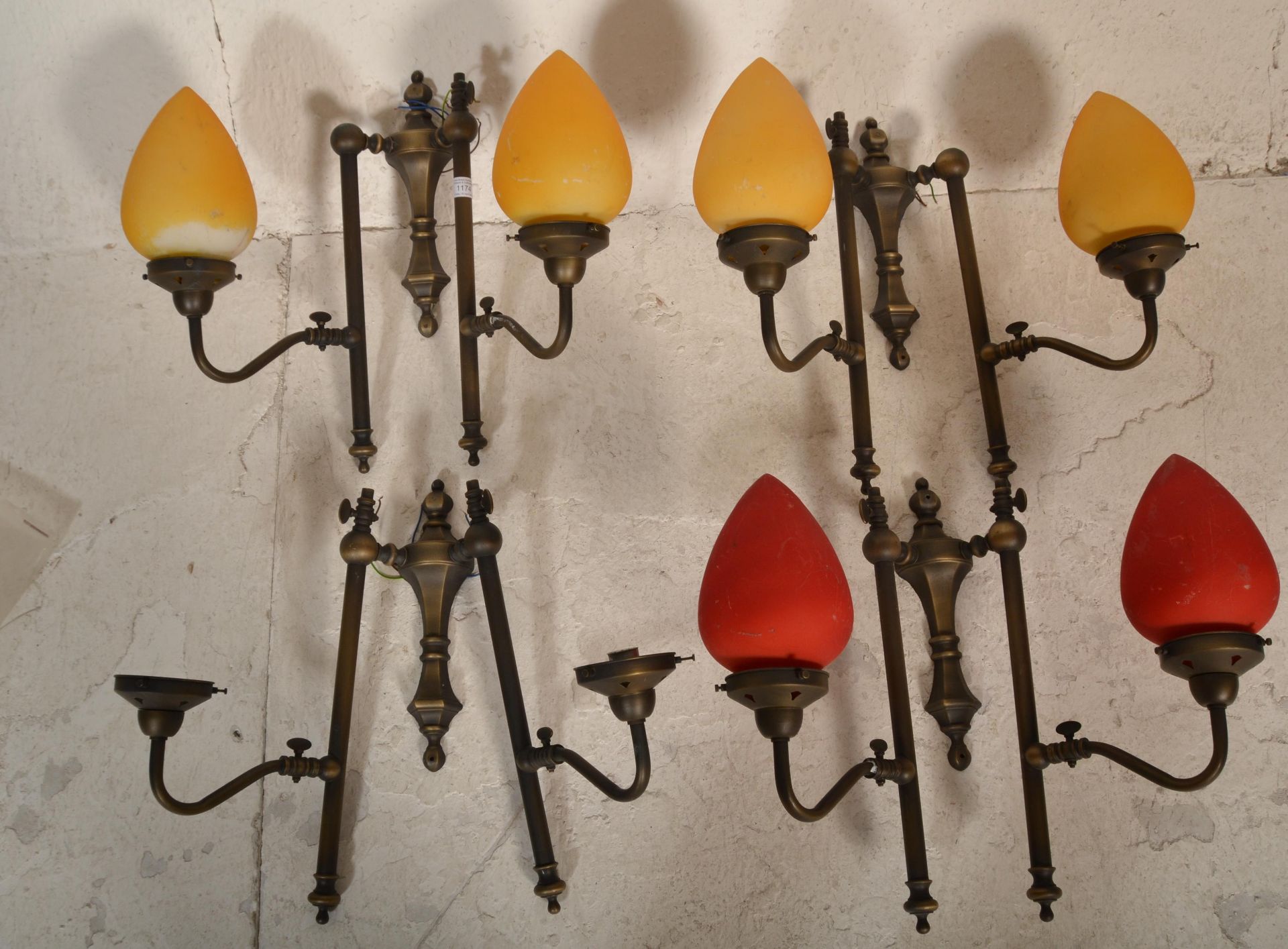 A collection of 20th century antique style lamps having bright and colourful teardrop shades. The