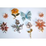 A collection of six vintage mid 20th Century brooches to include a blue enamelled flower brooch