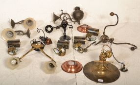 A collection of brass lights and fittings to include oil lamp style, twin sconce wall light, factory