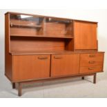 A retro 20th Century teak wood highboard sideboard credenza, being raised on square supports having