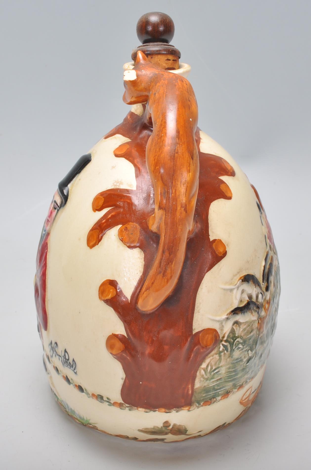 An early 20th Century Crown Devon ceramic John Peel musical flagon flask / decanter having a moulded - Image 4 of 8