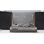 A retro 20th Century National Panasonic music center / stereogram model SG-1070L. Teak cased with