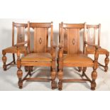 A good set of 6 Edwardian oak inlaid dining chairs being raised on cup and cover supports united