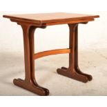 A nest of two vintage retro G Plan red label teak wood tables having rectangular tops raised on