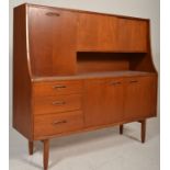 Brasilia - A retro 20th Century teak wood G-Plan highboard sideboard credenza, being raised on