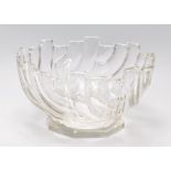 A vintage retro pressed glass centrepiece bowl raised on a footed base with a moulded geometric