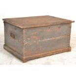 A Victorian 19th century painted pine blanket box chest of smaller proportions being raised on
