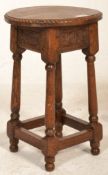 A good early 20th Century Arts and Crafts peg jointed oak stool raised on four turned supports