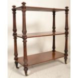 A 19th Century Victorian mahogany whatnot / etagere having three rectangular shelves supported by