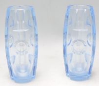A matching pair of early 20th Century Art Deco cut blue glass vases of barrel form with cut and