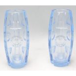 A matching pair of early 20th Century Art Deco cut blue glass vases of barrel form with cut and