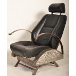 A retro 20th century car chair converted into a retro armchair in the manner of Ron Arad having