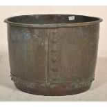 A large 19th Century Victorian copper planter of hammered construction with banding and flared out