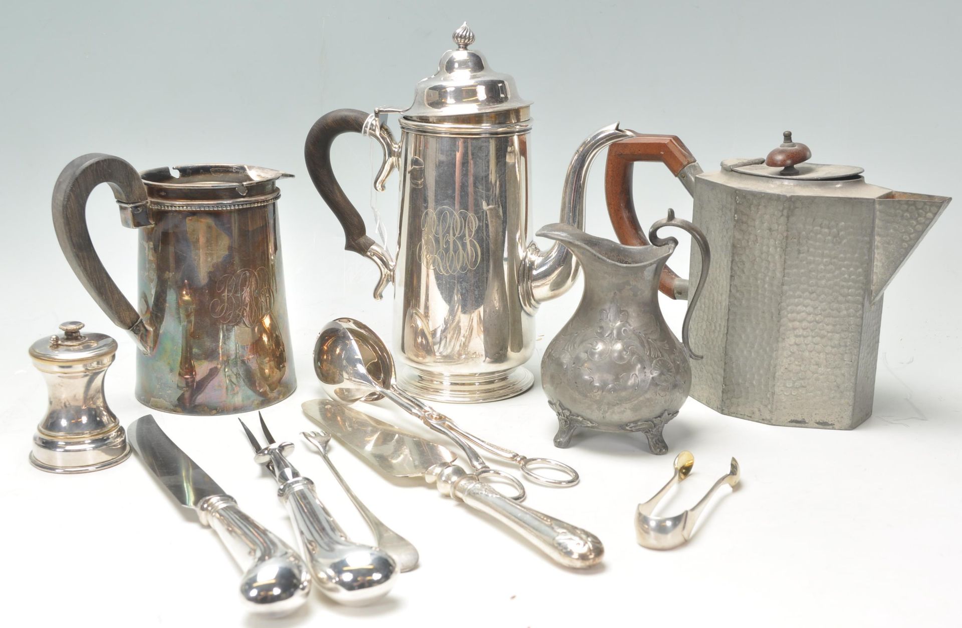 A collection of silver plated wares to include a good Gm Co EP coffee pot, Arts & Crafts Tudric type