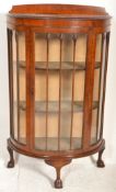 A 1930's Queen Anne walnut half moon / demi lune china display cabinet vitrine with lined shelves,